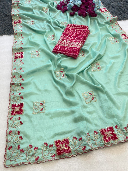 Elegance Premium Chinon Fabric Saree. Zari Embroidery Work With Sequence Work Designer Saree. The border also has rayon bandhani print butta With Beautiful Floral design. In All Over Saree